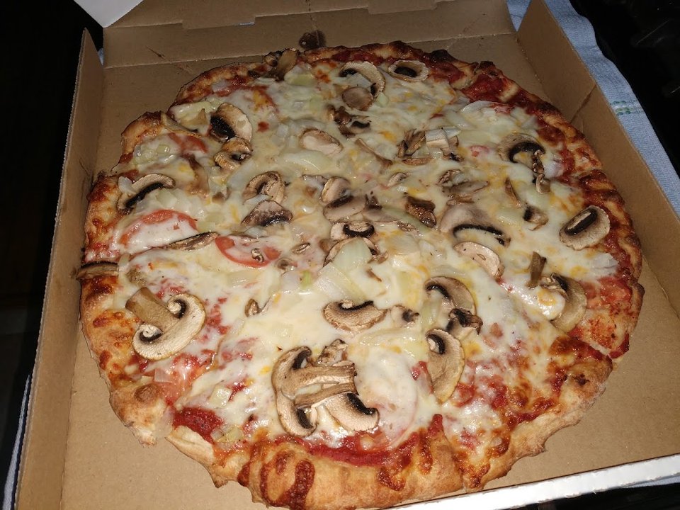 Pizza with Mushrooms Onions and Tomatoes